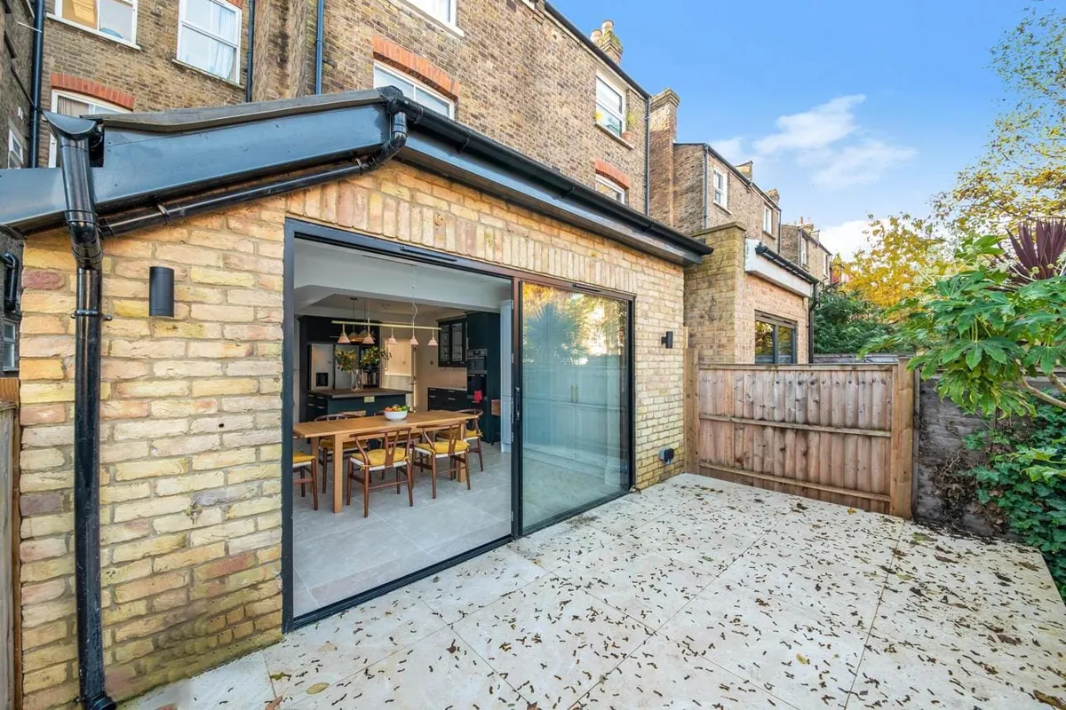 Rear house extension in brick with bi-fold doors onto the garden, London