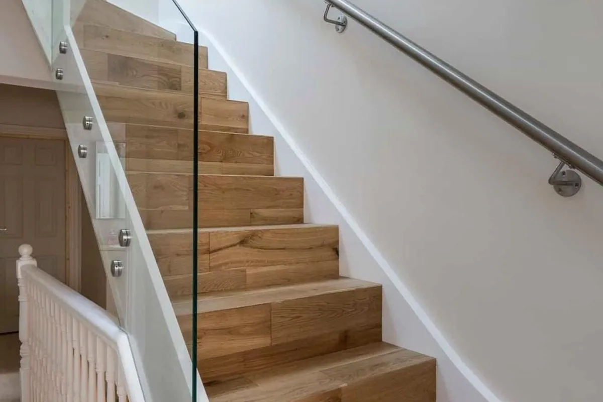 Oak staircase with glass balustrade, London